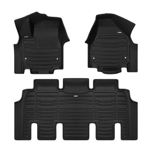 A set of black TuxMat car floor mats for Chrysler Grand Caravan models.