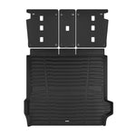 A set of black TuxMat trunk mats for BMW X5 models.