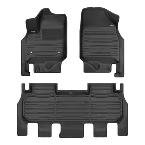 A set of black TuxMat car floor mats for Chevrolet Traverse models.