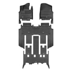 A set of black TuxMat car floor mats for Kia Carnival models.