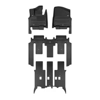 A set of black TuxMat car floor mats for Kia Carnival models.