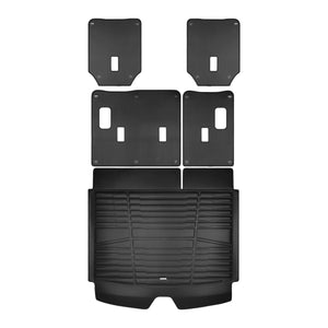 A set of black TuxMat trunk mats for Chevrolet Suburban models.