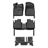 A set of black TuxMat car floor mats for Mitsubishi Outlander models.