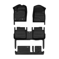 A set of black TuxMat car floor mats for Nissan Rogue models.
