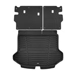 A set of black TuxMat trunk mats for Kia Seltos models.