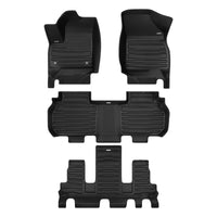 A set of black TuxMat car floor mats for Chevrolet Traverse 7-Seater models.