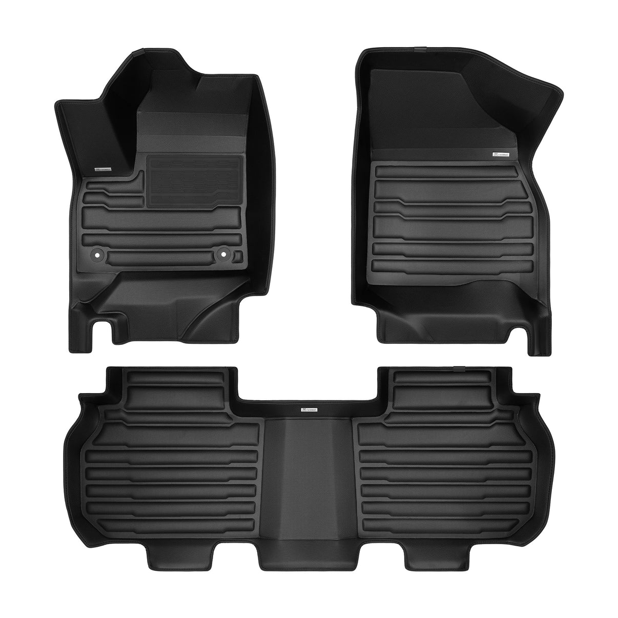 A set of black TuxMat car floor mats for GMC Acadia models.