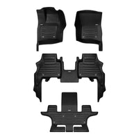 A set of black TuxMat car floor mats for Land Rover Defender 130 models.