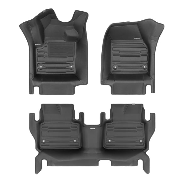 A set of black TuxMat car floor mats for Land Rover Discovery Sport models.